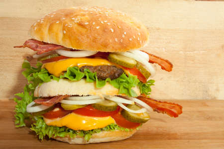 Tasty double homemade hamburger on natural woodの写真素材