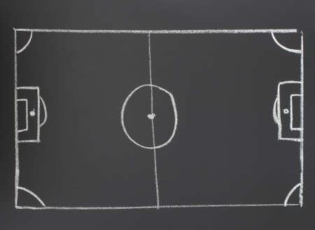 Picture a football field with chalk on a blackboardの写真素材