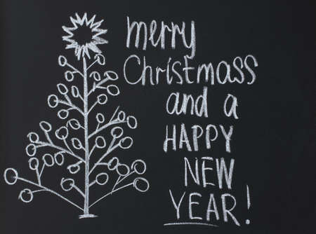 drawing and lettering in chalk on a blackboardの写真素材