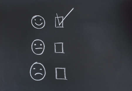 drawing with chalk on a blackboardの写真素材