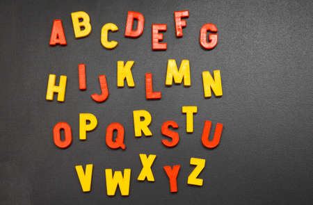 letters of the alphabet arranged on a blackboardの写真素材