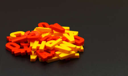 letters of the alphabet randomly arranged on a blackboardの写真素材