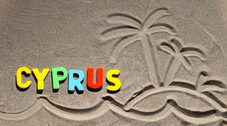 inscription lined letters on the sandの写真素材