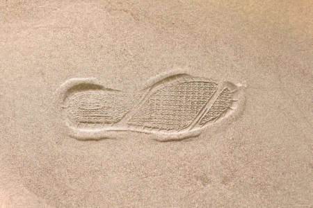 shoe print in the sand