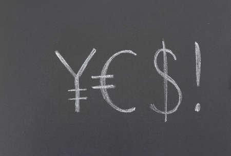 drawing with chalk on the blackboardの写真素材