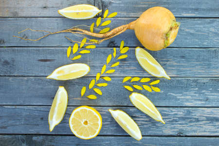 Concept autumn harvest lemon and flower petals. Selective Focus