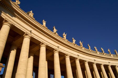 Architectural detail of the columns in the Vatican City square in Rome. Italy. Religious sculptures.の写真素材