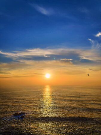 Sunset on the western coast of Portugal near to Lisbon, Cabo da Roca. Intense blue sky.の写真素材