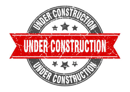 under construction round stamp with red ribbon. under construction