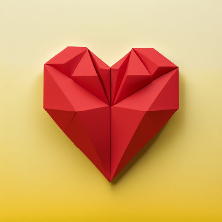 Valentine card. Heart. Love background. Red paper origami heart on yellow backgroundの写真素材