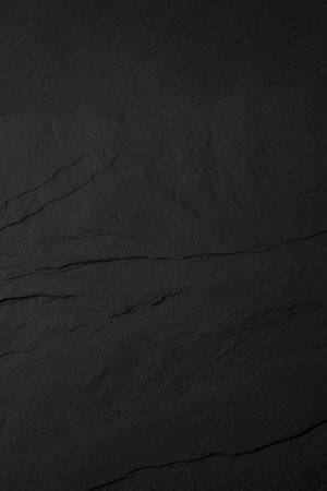 Black stone texture. Slate background. Dark grey black slate background.の写真素材