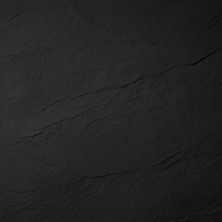 Black stone texture. Slate background. Dark grey black slate background.の素材