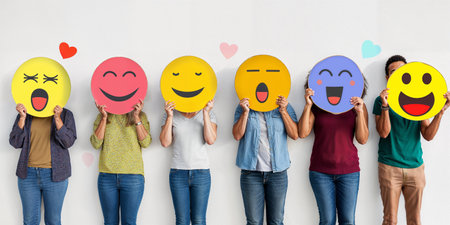 A group of diverse people holding happy emoticons. Healthy workplace culture concept. Teamworkの素材
