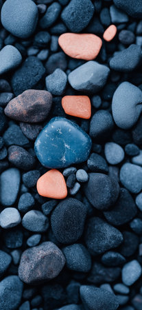 Smooth round colorful gravel stone texture. Polished opal pebble background