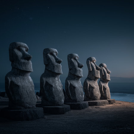 Ancient Moai statues standing by the ocean under a night sky with bright moonlight. Moai statues on Easter Island watching rising moonlightの写真素材