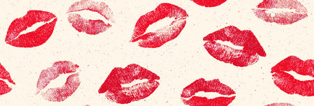 Red lipstick kiss marks covering a cream textured paper surface, creating a playful pattern. Red...