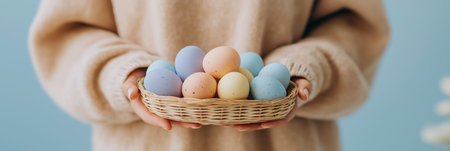 Person holding a small basket filled with colorful speckled Easter eggs in hands. Easter background....