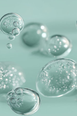 Clear microbubbles suspended in a light aqua-tinted transparent serum creating a hydrating texture....