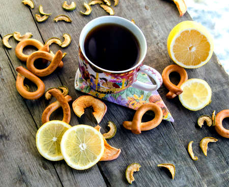 Cup of tea with lemon on a wooden tableの写真素材