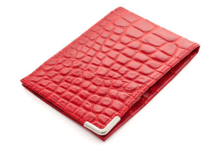 Red leather card holder on a white backgroundの写真素材