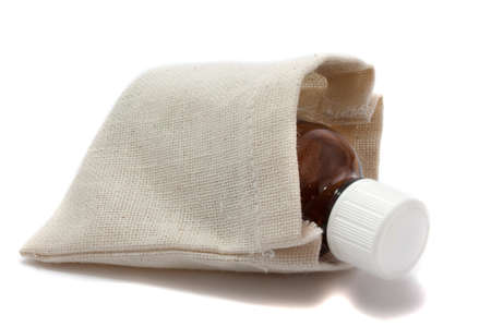 Medicine in the rough gray bag on white backgroundの写真素材
