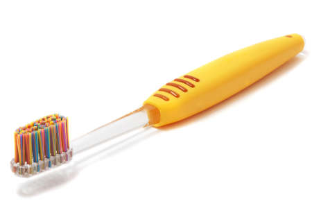 Yellow toothbrush bristles with color-coded on a white backgroundの写真素材
