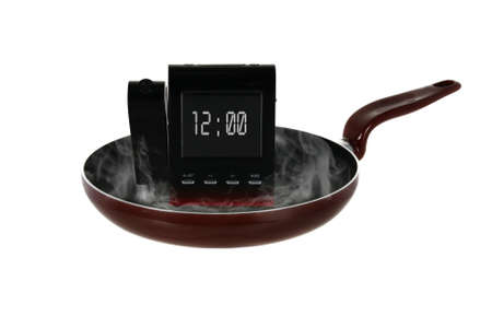 Smoking electronic clock in the pan redの写真素材