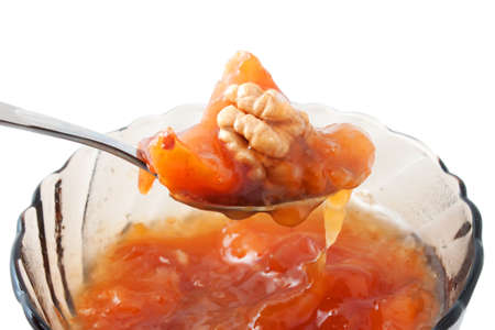 Peach jam nut with a spoonの写真素材