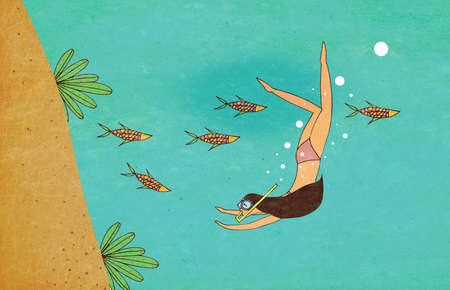 Girl diving under the seaの写真素材