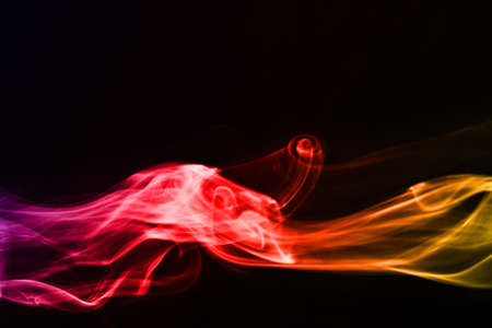 The abstract smoke on the dark backgroundの写真素材