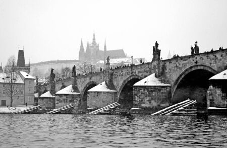 B/W view from river to Charles bridge and Prague castleの写真素材