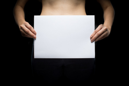 Topless Woman with blank sign - concept photo of sexual assaultの写真素材