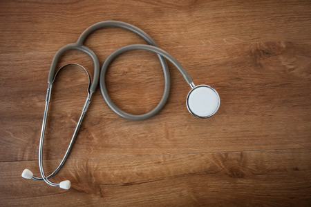 Medical Stethoscope on a wooden backgroundの写真素材