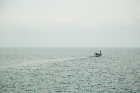 Seascape. boat on a quiet sea surfaceの写真素材