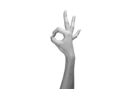 Hand OK sign isolated on white backgroundの写真素材