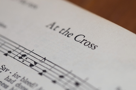 CHIANGMAI, THAILAND, April 21,2015. Singing The Christian Hymnal book on the song of " At the Cross " at home. April 21,2015のeditorial素材