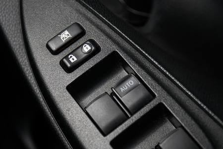 Car Door Lock Button Closeup. Electric Locking Button in Modern Car