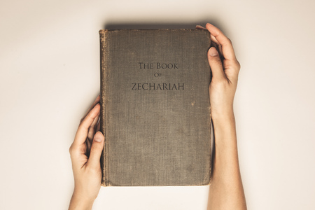 Vintage tone of hands hold the book bible of zechariahの写真素材