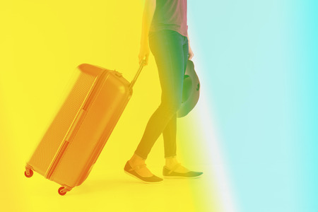 Vintage tone of Exciting Asian woman drag a luggageの写真素材