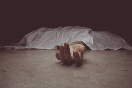vintage tone of The dead woman's body. Focus on hand