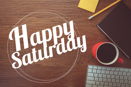 Happy saturday on notebook , pencil and coffee cup with vintage filterの写真素材