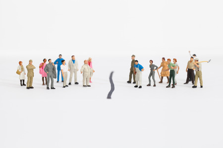 some miniature businessmen fighting against workersの写真素材