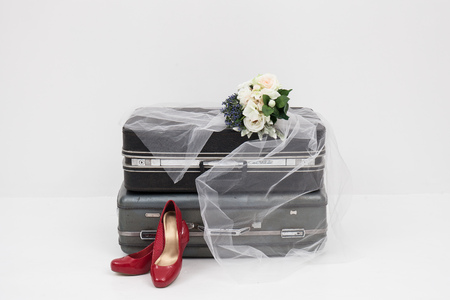 suitcase with shoes, and flower ready for travelの写真素材