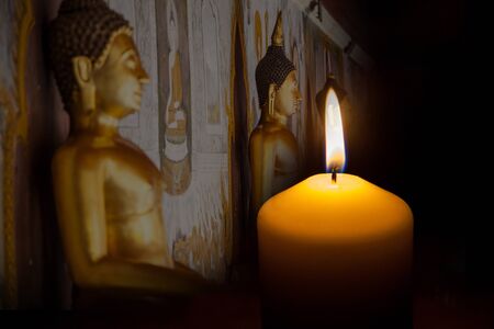 Candle on black backgroundの写真素材