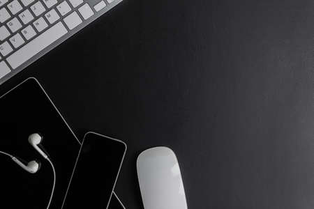 Working items, keyboard, mouse and phone mock up on a table.の写真素材