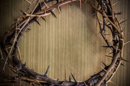 A thorn crown on wooden table, religion concept.
