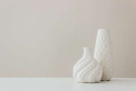 Two vases on table over the light background.の写真素材