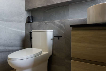 A clean white toilet blow in a restroom.の写真素材