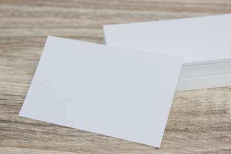 A blank note paper on wooden background.の写真素材