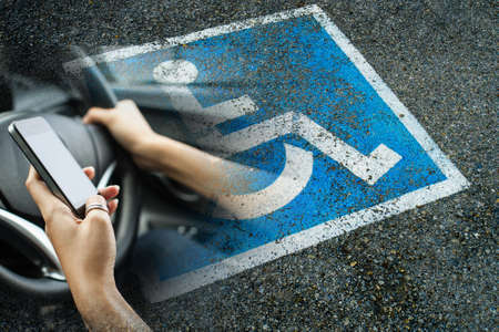 Driving while using a cell phone, accident concept.の写真素材